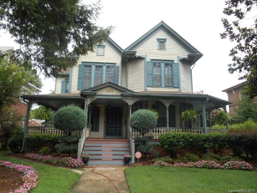 Queen Anne style home sensitively restored and updated.Turn-of-the-century architecture includes:wrap porch, Victorian trim, high ceilings, paneled doors, original moldings, bay windows, gables, built-ins, wainscoting, stained glass transom, and wide hart pine flooring. 6 fireplaces, 1 with gas logs; all have wooden mantels & 2 have faux marble surrounds. Kitchen has ceramic tiled floor/back splash, solid surface counter tops and island has granite top. Water feature in private fenced back yard.