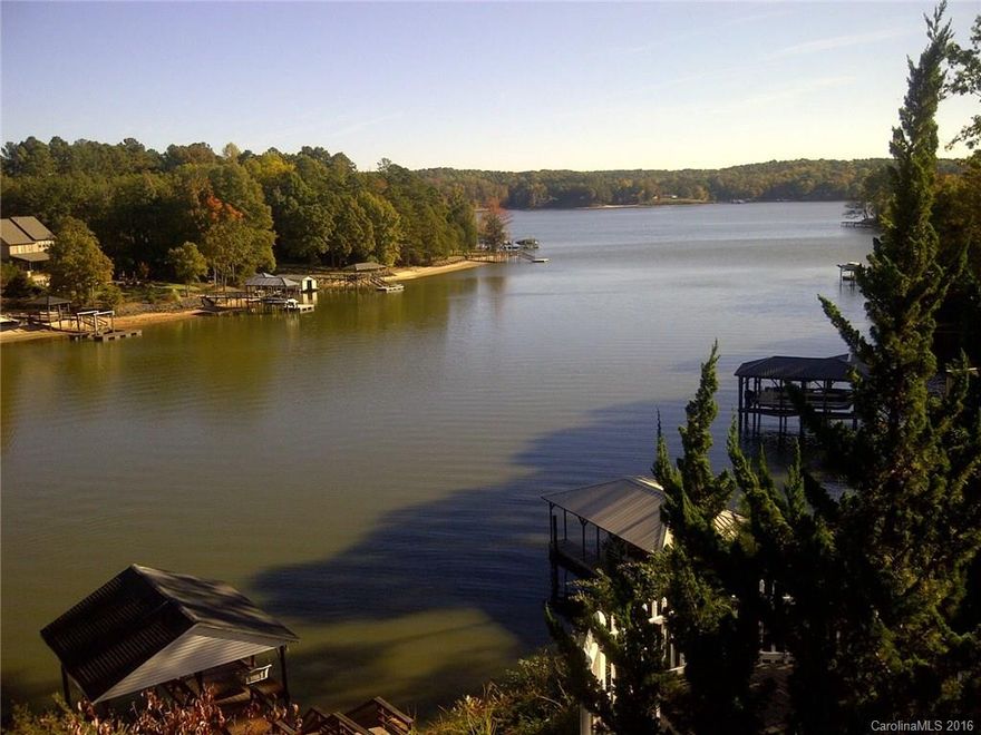 Private waterfront with amazing views of Lake Wylie main channel! Walking distance to restaurants, shops and many amenities! Close to one acre waterfront lot with deep boat dock. Screened porch, Large master suite on main level, gourmet kitchen, huge bonus room!