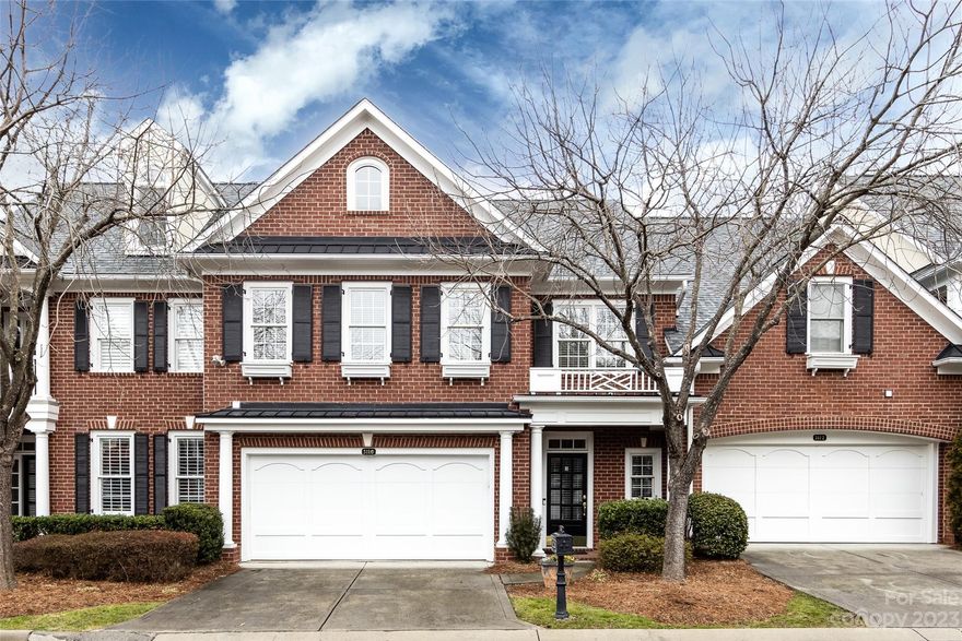 Wonderful transitional style, 1 1/2 story townhome, convenient to Arboretum, I 485, shopping & dining. Light filled foyer w 1/2 bath & storage closet. Impressive 2 story great room with fireplace & lots of built ins. Great room also has space for dining area. Kitchen updated in 2018 with quartz countertops, marble backsplash, new appliances, new sink, new disposal, decorative wallpaper. Kitchen is open to Great room. HAVC with dual thermostats replaced in 2019, water heater replaced 2019. HOA replaced roof in 2021. Sought after primary bedroom on the main level. 2nd level features 2 bedrooms and  spacious open loft. Enclose private patio! Carpets cleaned, fresh paint in multiple areas. WAsher/dryer and refrig remain. Come see!