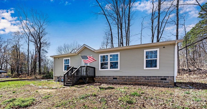Conveniently located just 10 minutes from Taylorsville, this charming Manufactured 2020 home sits on a spacious .93-acre lot with quick access to Hwy 64. USDA ELIGIBLE (ZERO DOWN PAYMENT HOME LOAN). Inside, you’ll find a bright, open floor plan with a desirable split-bedroom layout. The kitchen is a standout feature, complete with a large island, farmhouse sink, built-in bookshelves, and a stainless-steel vented hood—perfect for both everyday living and entertaining. The primary suite offers a double vanity for added comfort, while sheetrock walls throughout provide a clean, modern feel. Outside, you’ll find a 12x24 storage building with a roll-up door, ideal for tools or hobbies. Enjoy peaceful surroundings with room to spread out, all while staying close to town.