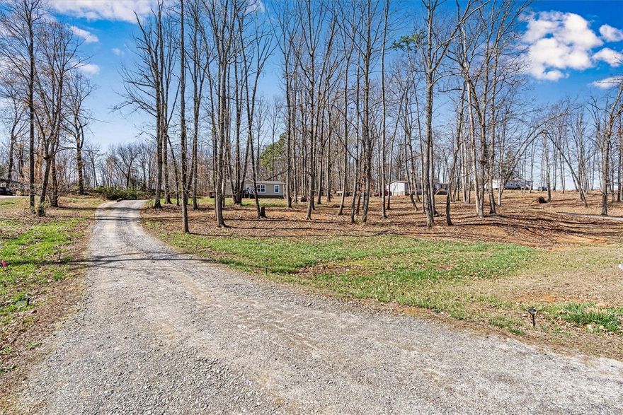 ****ATTENTION UPDATE****- SELLER IS OFFERING 3% CONCESSION TOWARD BUYER EXPENSES, USABLE AT THE BUYER'S DISCRETION. Conveniently located just 10 minutes from Taylorsville, this charming Manufactured 2020 home sits on a spacious .93-acre lot with quick access to Hwy 64. USDA ELIGIBLE (ZERO DOWN PAYMENT HOME LOAN). Inside, you’ll find a bright, open floor plan with a desirable split-bedroom layout. The kitchen is a standout feature, complete with a large island, farmhouse sink, built-in bookshelves, and a stainless-steel vented hood—perfect for both everyday living and entertaining. The primary suite offers a double vanity for added comfort, while sheetrock walls throughout provide a clean, modern feel. Outside, you’ll find a 12x24 storage building with a roll-up door, ideal for tools or hobbies. Enjoy peaceful surroundings with room to spread out, all while staying close to town.