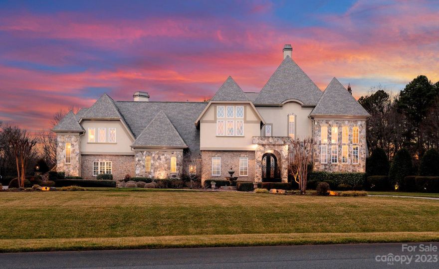 Look No Further! With over 3 acres of immaculately maintained landscaping, this gorgeous estate has it all! With stunning brick & stone exterior, this 5 bedroom, 7 full bathroom home boasts over 7000 sq ft HLA w/ walnut hardwood floors throughout. A chef's dream gourmet kitchen comes fully equipped w/ beautifully custom designed cabinetry, oversized island, granite countertops, high end appliances & ample space for entertaining. Relax & unwind in the gorgeous wine cellar. Primary suite w/ luxurious bathroom & custom designed closet located on main level w/ private entry to the exquisite outdoor terrace overlooking the plush yard & fully equipped outdoor kitchen. Oversized screened porch is the perfect place to entertain, relax or roast s'mores from the outdoor fireplace. Detached Carriage House provides a 2nd living quarter w/ bedroom, full bath, living area, laundry & full kitchen. The intricate detail & design of this estate is surely one you will fall in love with.