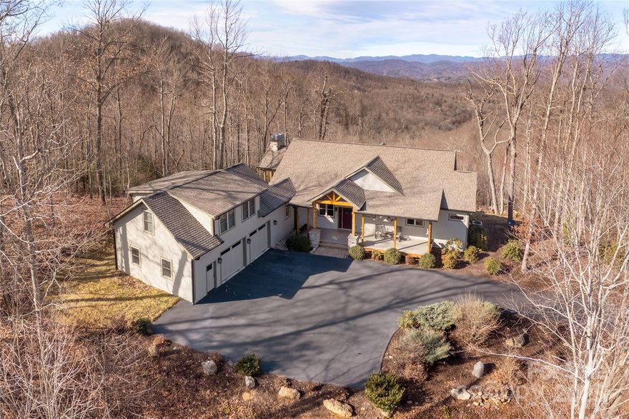 Discover your dream home in Brevard, this exceptional 4 BR, 5 BA house is perfectly nestled on a generous 5.5 acres of private land, offering unparalleled tranquility and stunning panoramic views of the Blue Ridge Mountains. As you approach the property, you’ll be greeted by the serene beauty of nature and the majestic mountains in the background.  Step inside to find a well designed interior that seamlessly blends comfort and style. The spacious kitchen is a culinary dream, featuring a large island and breakfast bar, perfect for gathering with family or entertaining friends. Beautiful hardwood floors gleam throughout the home. There is a large suite over the garage, providing an ideal retreat for guests or family. 
The expansive covered deck is an entertainer's delight with a wood-burning fireplace to unwind in the evening, offering the perfect setting for al fresco dining as you watch the sunsets over the mountains.  The expansive grounds provide ample space for outdoor activities, gardening, or simply soaking in the peaceful surroundings. A plus is the large 2+ car garage, providing plenty of space for vehicles or additional storage.
Situated just minutes from downtown Brevard, one of America’s Coolest Small Towns, this property is a nature lover's paradise. Embrace the lifestyle you’ve always dreamed of—breathe in the fresh mountain air, explore nearby Pisgah National Park or the many outdoor recreational opportunities, fishing, hiking, or biking.  Don’t miss this rare opportunity to own a piece of mountain paradise that combines luxury, comfort, and breathtaking views.