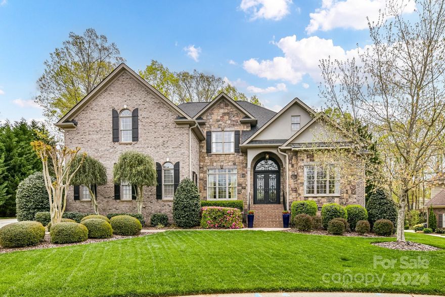 Sophisticated luxury & exquisite craftsmanship awaits this European styled custom home in coveted & gated Stratford Hall! Located on a private cul-de-sac w/striking street presence! Enter the vestibule w/iron artisan doors & brick/stone facade. Vaulted 2-story foyer, Dining Room w/wet bar & Library w/wood paneled walls & coffered ceiling. Stunning millwork, wide plank wood floors and the best in quality & design! Great Room w/FP & Built-ins, Chef’s Kitchen w/Dacor, Bosch & HUGE quartz island. Light filled breakfast area leads to screened porch. Hearth room w/vaulted ceiling & 2nd Fireplace. Lavish Primary Suite on main w/cove lighting! Spa bath w/dual closets. Expansive laundry room! Upper Level:3 generous bdrms, billiards w/wetbar, flex space AND WI attic. Private fenced backyard overlooking saltwater pool, hot tub, FP & Grilling center. Multi- levels of terrace & pavers. 3+car garage. This warm/engaging/meticulous home is designed for STAYCATION living- close to schools/shops/dining!