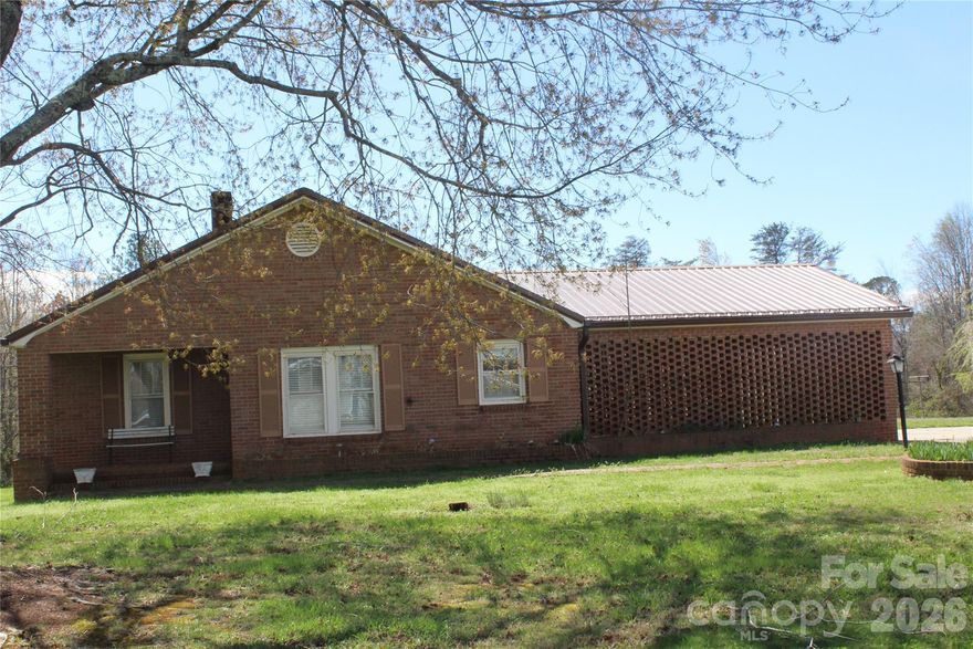 Come and check out this beautiful brick ranch-style home, just minutes away from downtown Morganton! This home features an eat-in kitchen and dining room, living room, and den with a wood stove, 2 beds and 1 bath, and a lower-level laundry room, car garage, all on 5.84 beautiful acres.  Whether you're looking for a hobby farm, space for animals, gardening, or simply peaceful country living--this home could be the one for you! Expansive acreage offers privacy, scenic views, and plenty of room to expand or build additional structures!