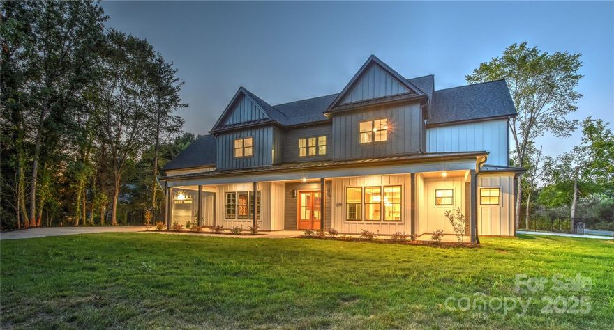 Welcome to this extraordinary brand new custom home, a 5,000+ sq ft showcase of craftsmanship and comfort in the Lake Norman Golf Club community—where you’ll enjoy modern luxury, a gorgeous pool & spa, and no HOA, with partial lake views. Unlike most custom homes that require a 12–18 month build process, this home is fully completed and move-in ready—delivering true custom craftsmanship without the wait. Set on a half-acre corner lot, it allows for two separate driveways - one leading to a two car side load garage, and another to a private single car garage ideal for a golf cart, extra car, or workshop access, giving the home true estate presence and enhanced functionality. This custom home was thoughtfully designed to elevate both daily living and entertaining.

Step inside and be captivated by the soaring great room, anchored by a designer crystal chandelier, custom built-ins, and a sleek linear LED fireplace. The gourmet kitchen is a showpiece for entertaining with its dramatic waterfall island, custom cabinetry, professional-grade range, hidden scullery with wine fridge & 2 dishwashers. Throughout the main living areas, pre-finished wide-plank hardwood floors provide seamless elegance—no carpet anywhere.

The main-level primary suite is a true retreat, with heated tile floors, spa-inspired bath, and a huge custom closet. Additional spaces include a dedicated office with built-ins, mudroom with built in's, abundant storage, and two laundry rooms—one upstairs and one on the main level—for ultimate convenience. Upstairs, discover 3 bedrooms, a loft lounge with wet bar, and a large bonus room that can double as a 5th bedroom, wired for a sports simulator, gaming, or theater.

Outdoors, the lifestyle continues: expansive covered patios with tile floors overlook your saltwater pool & spa with LED lighting and a level fenced in backyard perfect for entertaining. Pet lovers will appreciate the built-in wash station in the garage and custom feeding station in the mudroom, complete with built in bowls and a dedicated faucet. Thoughtful details include a water softener system, and custom closets in every bedroom.
Two garages with separate ample parking driveway areas, energy-efficient systems, and floor-to-ceiling designer tile in every bathroom complete the package.

Nestled at the end of a quiet peninsula, and within the Lake Norman Golf Club community (formerly Mallard Head), this home offers more than just a place to live—it’s a lifestyle. The club is open for play and undergoing extensive renovations that will transform it into one of the premier golf destinations in the area. Each drive to and from home takes you past the greens, and Spring Run provides one of Mooresville’s most popular walking & biking routes along the course. Ideally located just minutes from shopping, dining, and everything Lake Norman has to offer, this residence delivers the perfect blend of lifestyle, convenience, and prestige - all without the restrictions of an HOA. Move-in-ready custom homes like this are a rare find in today’s market. Don’t wait—schedule your private showing today before it’s gone!