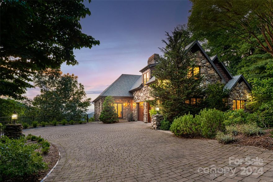 European design meets the mountains! A true "Grove Park Inn" residential twin design. Western facing layered mountain views from multiple rooms.  Brazilian cherry hardwood floors, arched doors, hand-built curved staircase. Chefs kitchen with long range views. Mahogany cathedral style entry door, outdoor grill, wet bar and fireplace that overlook the Blue Ridge Mountains. Flat driveway with 3 car garage. This home is an Entertainer's paradise in north Asheville.  4/5 bedroom home with all bedrooms offering en-suite baths.  4 fireplaces, Ultimate privacy.   Two home offices, theatre room, exercise room, upper and lower level Great Rooms each with a fireplace. Simply must see to appreciate. All new HVAC systems (3) !