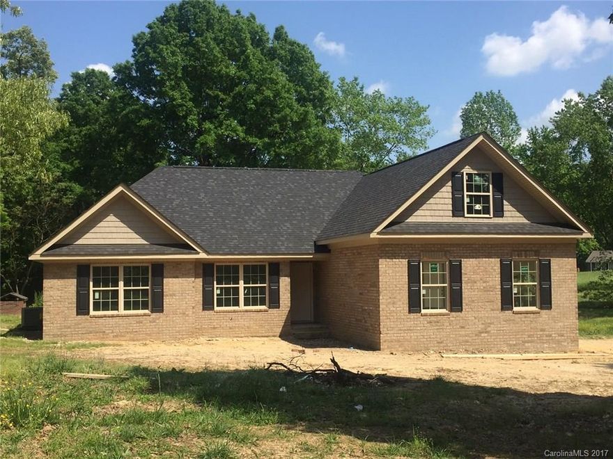 Hurry to choose remaining color/flooring choices!  New construction in great location!  All brick home nestled with an abundance of mature trees!  Estimated completion for home is May 31, 2017!  Perfect time to move and enjoy peaceful, quite, country living but convenient to shopping, schools, medical facilities, and the Monroe bypass currently under construction.  Convenient to I-485 as well as Hwy 74