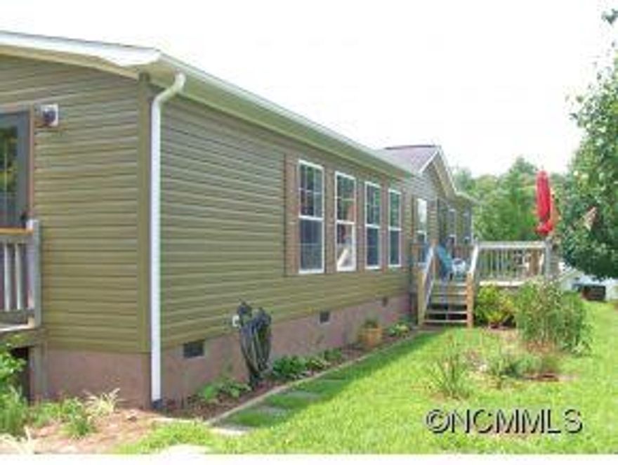 This home has amazing year round mountain views and recently had renovations including new paint both inside and out, new flooring, new lighting fixtures, new storm doors, new washer and dryer that conveys and new landscaping. Homes features also include a wood burning fireplace, jetted tub in the master bath, large pantry/mudroom, walk-in closets, additional storage shed and large deck to enjoy the view. This is a fantastic home for the family.