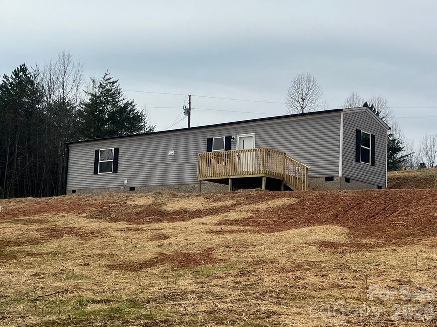 Brand New 2 bedroom 2 bath Clayton Singlewide Mobile home on .80 acres.