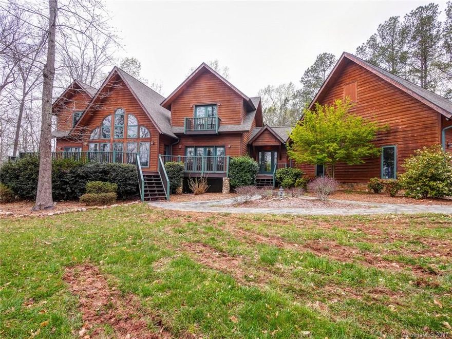 Fantastic home on private  2.23 acre lot with huge detached oversized 3-car garage,  towering ceilings, open floor plan, massive stone fireplace in living room and in recreation room. Walkout basement.  Large covered back porch overlooking gorgeous in-ground pool. Basement features a bar great for entertaining! Mountain style home living just a short drive from Charlotte! Full one year 2-10 Home Buyers Warranty included for buyer.