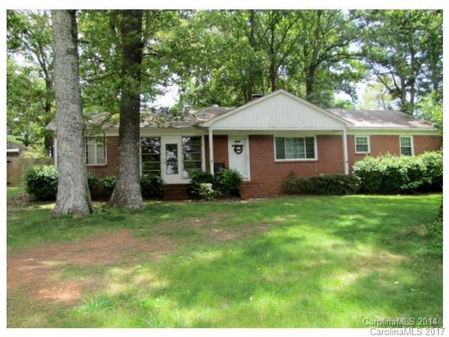 One of a kind Derita gem is here! Cute brick ranch on almost 1/2 acre lot!! This unique home features an eat-in kitchen, hardwood floors, and a wood-burning fireplace! The stunning, fenced back yard has lots of mature shade trees, and the awesome screened patio, small garage and attic make this must see! Just down the road from RibbonWalk Nature Preserve, and minutes to I-77 and I-85!