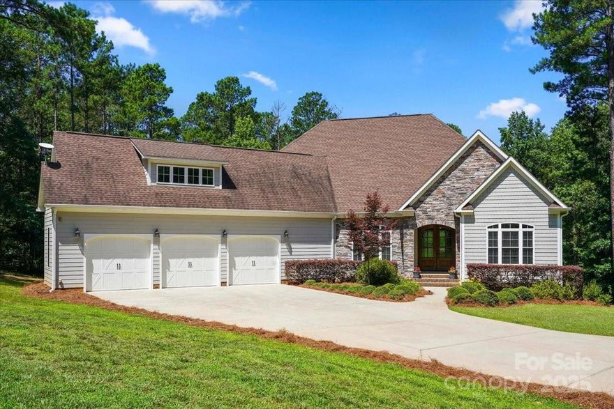 Experience the perfect blend of luxury, comfort, and privacy in this stunning custom-built home, gracefully positioned on 6 acres of wooded serenity. From the moment you step inside, soaring ceilings and expansive windows draw your gaze through to the picturesque backyard and lush wooded landscape beyond. The main-level primary suite is a true retreat, featuring large windows that frame peaceful views of nature. The spa-inspired ensuite bath includes a beautiful, oversized walk-in shower, offering a rejuvenating escape from the everyday.  Secondary bedrooms are ideally located on the opposite wing of the home and share a well-appointed Jack-and-Jill bathroom. Upstairs, a spacious bonus room offers versatility for entertainment, work, or relaxation, while a generously sized attic provides excellent storage.  An added bonus is the detached 1-bedroom, 1-bath guest home—perfect as an in-law suite, private office, or income-producing rental.