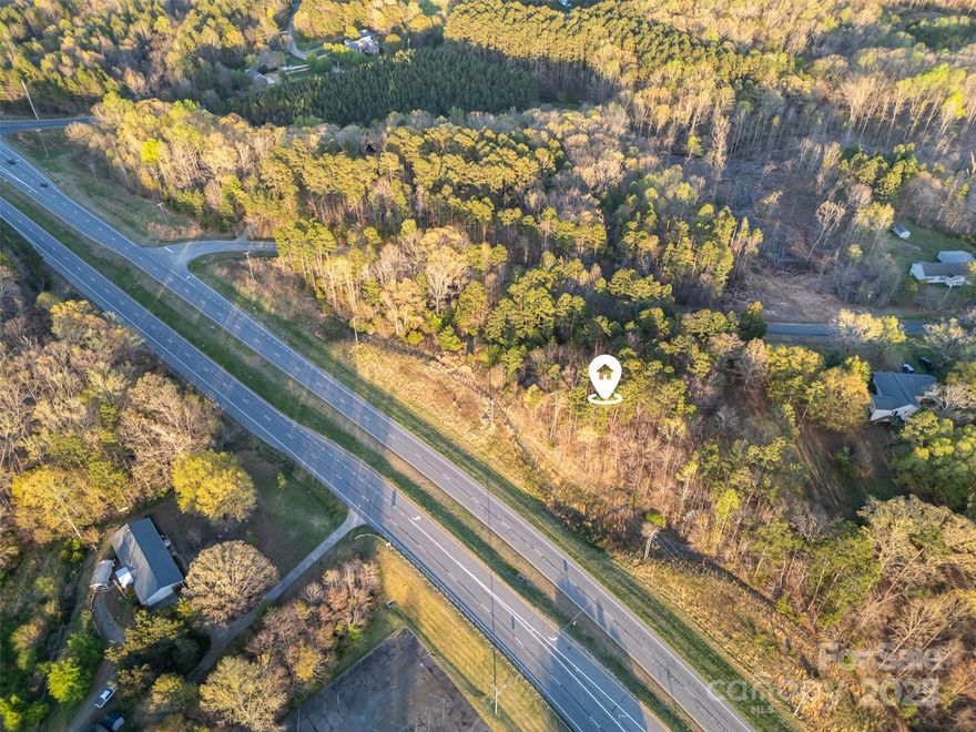 Discover the perfect canvas for your dreams with this exceptional raw land located directly on Highway 49, just moments from the 601 exit. This property is strategically positioned to offer easy access to both Concord and Charlotte, making it an ideal choice for investors and future homeowners alike! With its prime location, the possibilities are endless—whether you envision a flourishing venture or a serene retreat to build your forever home, this land is ready to accommodate your vision. The area is rapidly developing, ensuring that your investment will only grow in value over time. Don't miss out on this unique opportunity to secure a piece of land in a thriving community! Survey in listing attachments