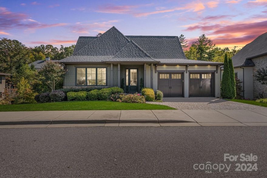 This home is situated in north Asheville only 4 miles from vibrant downtown in the highly sought-after Thoms Estate which offers a thriving and active private community experience with pickleball, bocce ball, basketball, community garden, 32 acres of green space, miles of trails and many, many, social activities. The home is move-in ready and offers main-floor living, boasting impeccable craftsmanship with stunning maple floors and an open floor plan. The main floor has a master suite with 2 additional split-plan bedrooms (or use one as an office) and integrates a beautiful kitchen, living and dining room, and a main floor screened porch that overlooks a beautiful greenspace. Downstairs there is a 2nd master suite, family room, wet bar, wine cellar, flex space and screened porch. All lawn and garden areas are meticulously maintained by the HOA making this home ideal for the world traveler.