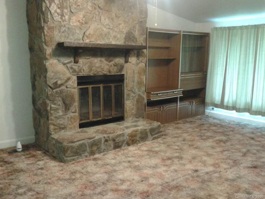 Need 4 bedrooms check this one out! 2 1/2 bath den, Greatroom and Kitchen. Glassed in back porch beautiful .92 acre lot beautifully landscaped. Storage building and one car garage detached carport. Property is Estate. Fireplace in Greatroom will no longer burn wood chimney has been sealed and removed. Can install gas logs.