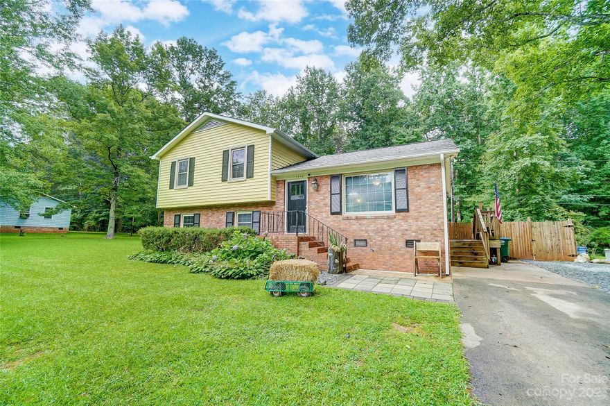 MULTIPLE OFFERS RECEIVED. HIGHEST & BEST DUE by 7pm 7/17. Welcome to this classic design w/ modern updates, providing a comfortable & inviting living space. This 4BR, 1.5BA home is move-in ready. Step inside & be greeted by an inviting foyer that leads to a spacious living room w/ gleaming floors that extend throughout the main level. The open-concept layout seamlessly connects the living room, kitchen, & dining area. Kitchen is outfitted w/ white cabinetry, tile backsplash, & SS appliances. A spacious primary bedroom & two additional bedrooms are located on the upper level, all including carpet, ceiling fans, & neutral paint. On the lower level, you’ll find a room perfect for an additional BR or office/lounge space & a recreational room! The enchanting screen porch invites you to unwind while having a full view of the fully fenced backyard. The backyard offers great privacy & is perfect for outdoor activities. Don’t miss the opportunity to make this exceptional house your dream home!