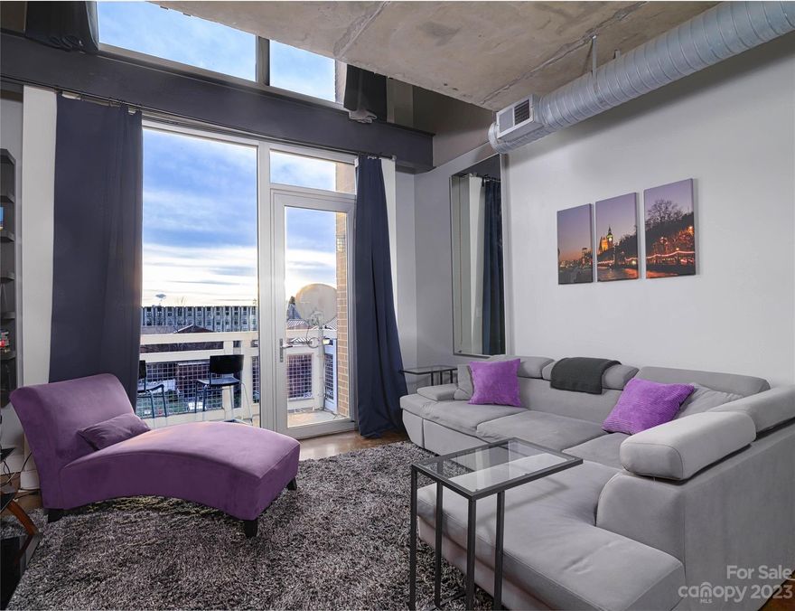 Urban living meets sophistication in this downtown,2 story loft condo. Cathedral ceilings that exude a sense of grandeur. Revel in the spectacular views from the 9th story.
The 19-foot ceilings contribute to a warm, bright, & open atmosphere with an industrial aesthetic. 
The great kitchen is a focal point, dining bar peninsula, open to views.
Light floods floor-to-ceiling, wall-to-wall windows. The loft bedroom affords one of the best views in Charlotte, creating a daily spectacle with 50+ nights of visible fireworks from the living room & bedroom.
This residence offers a front-row seat to the city's spectacular growth into the next decade. A streetcar stop is conveniently on the same block. This versatile loft is not just a home; it's an investment opportunity. Rentals are available to any investor with a 30-day minimum lease period. Don't miss the chance to own a piece of the evolving Downtown Charlotte Skyline. Embrace urban sophistication & make this exceptional loft your own!