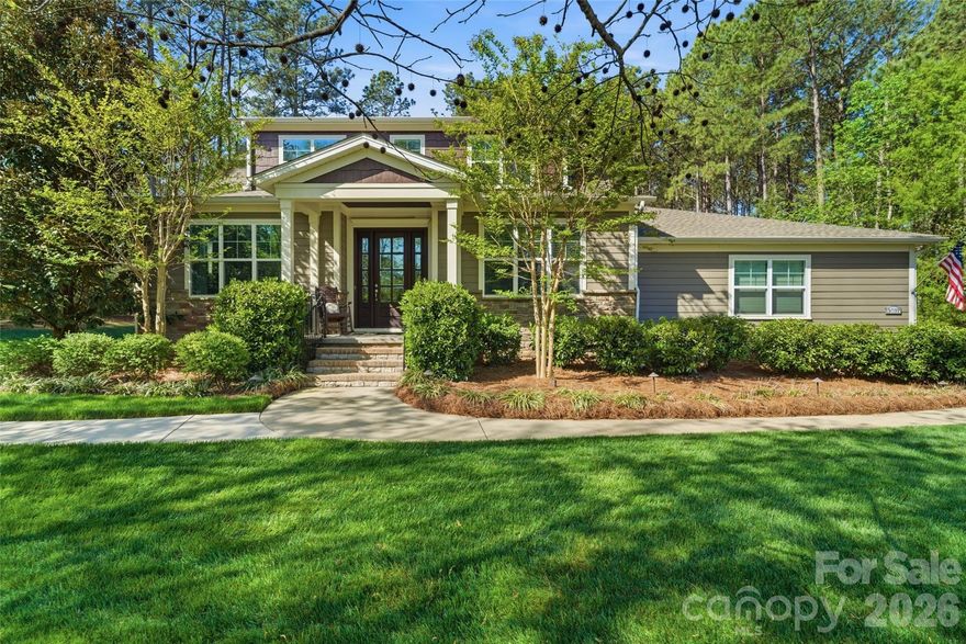 Nestled in the desirable Riverchase Estates community, this beautiful Craftsman-style home offers peaceful wooded views from every level. Thoughtfully designed and well-maintained, it showcases exquisite attention to detail, from elegant tray ceilings and designer lighting to custom built-in wall units. Expansive windows fill the home with natural light while framing breathtaking views of the private, wooded lot. A dedicated office provides the ideal work-from-home space. The gourmet kitchen is a true standout, featuring top-of-the-line stainless steel appliances, a large center island, gas range, and a pantry with custom shelving and lighting, all seamlessly connected to a functional open floor plan ideal for everyday living and entertaining. The main-level primary suite provides comfort and privacy, creating a true retreat within the home. Stacking sliding doors open to a covered back porch with a fireplace and outdoor kitchen, creating exceptional indoor-outdoor living. An extended paver patio offers additional space to relax or entertain while enjoying the serene backdrop, and a backyard storage shed adds convenience. A fully finished 2-car garage features upgraded rubberized flooring for a clean, modern look. Residents of Riverchase Estates enjoy exceptional amenities including a gated entrance, clubhouse, outdoor pool, tennis courts and more. Ideally located, this home offers the perfect balance of tranquility and accessibility, just minutes from Ballantyne, Indian Land, and interstate access. Schedule a showing today!