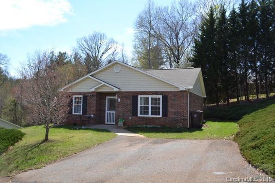 Wonderful brick 2BR/1.5BA home offers ease of one-level living!  Located in the heart of Glen Alpine in a certified 50+ year young community that offers homes with emergency call devices in each bedroom and bathroom and handicap accessible entryways.  Bright and open kitchen, living and dining room.  Kitchen appliances remain.  Two spacious bedrooms provide generous-size closets.  Full bath has walk-in shower and laundry connections.  Half bath centrally located for guests.  Close range mountain views from back patio.  Small yard and space for plantings.