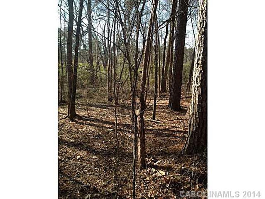 Approx. 2.4 acres of heavily wooded lot with many hardwoods, 3 miles from downtown Davidson, Lot fronts on cul-de-sac and backs up to pasture and gas line easement. Bring your own builder.
