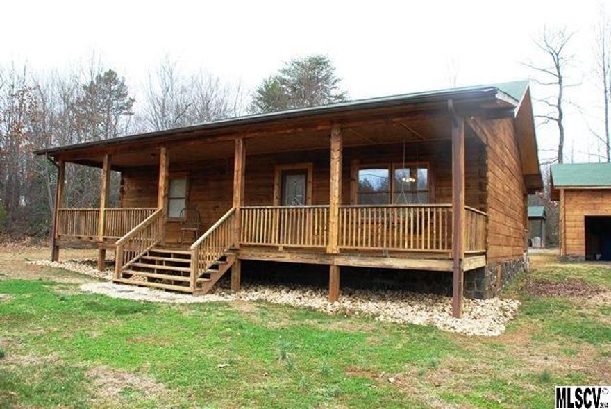 Fantastic ranch log home with 2BR/1.5BA. Features include gorgeous hardwoods covering the floors and walls , open floor plan in the living area w/vaulted ceilings, custom built kitchen cabinets & kitchen island.  Detached log carport and outbuilding provide ample storage and a spacious level yard.  Transferable termite bond also available.  Enjoy the feel of your own mountain retreat!