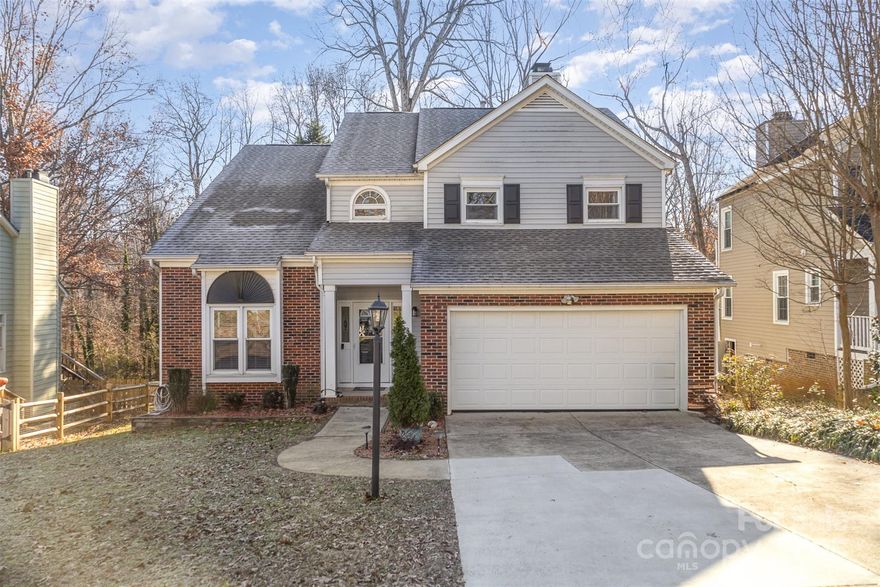 *$6,500 closing cost credit with preferred lender!* This impressive 4-bedroom, 3.5-bathroom home boasts a grand 2-story foyer and spacious open areas ideal for a home office or play space. The expansive eat-in kitchen and large living room with a cozy fireplace create a welcoming ambiance. Features include refinished stairs, a vaulted ceiling in the primary bedroom, and a beautifully designed primary bathroom. Relax in the screened porch or entertain on the patio, perfect for hosting gatherings.  The fenced yard overlooks lush natural scenery and a Barefoot pool, offering a serene retreat. Conveniently located near 77, 85, and 485, in an established community with amenities and mature trees. Kitchen and garage refrigerators included, low maintenance backyard, new carpet in the upstairs hallway, irrigation in front and side yards!  The 450 square foot basement (non-permitted by previous owners) includes a full bath, interior air vents, and outside access to a luxurious spa.