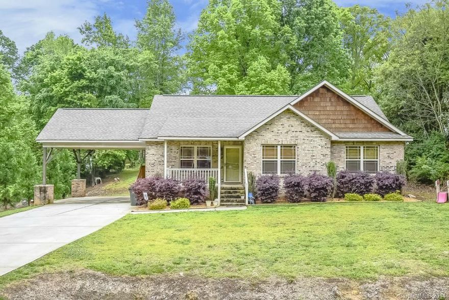 You will fall in love with the custom cabinets in the kitchen in this home with granite countertops and custom island. Type you would find in much higher priced homes! Great room has a corner fireplace with a tv niche behind deer mount. Enjoy the front porch that is large enough for rocking chairs or porch swing plus a nice deck for summer afternoon cookouts. Home is priced much lower than tax value.