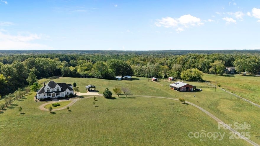 Exceptional 15.7-Acre Farm with Custom Home, Solar Power & Horse Facilities ~

Welcome to your dream farmstead! This 15.7-acre property combines modern efficiency with classic Southern charm, featuring a 3,440 sq. ft. custom-built plantation-style home and turnkey agricultural amenities ready for recreational enjoyment, horses, livestock, or hobby farming.

The 4-bedroom, 3.5-bath home offers spacious living with quality craftsmanship throughout—high ceilings, custom trim, and wide covered porches perfect for taking in the serene views. The open-concept kitchen and living area are ideal for family gatherings after a day on the farm, while the primary suite on the main level provides a quiet retreat with a spa-style bath and generous closet space. Two large walk in pantries, chef inspired appliances and ample counter space are ideal for your family cook. Upstairs are 3 additional bedrooms and oversized bonus room with its own closet space. The home has 2 natural gas tankless hot water heaters. 

Designed for the working or recreational farmer, this property includes:

* A 4-stall barn with a large tack room, feed storage, and wide overhangs on each side. 
* Two run-in sheds, each with large fenced paddocks for horses or livestock
* Additional storage areas for equipment and supplies
* 3 stall shed row barn for smaller livestock
* Chicken coop with large fully enclosed run
* Property perimeter fully fenced and gated. - 3 sides board fence and rear line in wire
* Productive, gently rolling pastureland ideal for grazing or future agricultural use. 
* 2 wells on property

Sustainability meets practicality with a fully transferable Enphase solar panel system and energy storage servicing both the home and barn—keeping energy costs low and operations efficient.

Located in a peaceful rural setting with easy access to Rock Hill, SC and Charlotte, NC, this property offers the perfect blend of country lifestyle and commuter convenience.Whether you’re looking to expand your farming goals, dreaming of your own farm property, or simply enjoy the peace and productivity of rural living, this farm offers it all—move-in ready and built to last.
** published previous Property tax amount is based on NON-Owner Occupied - This is NOT the correct amount it will be for a primary residence.