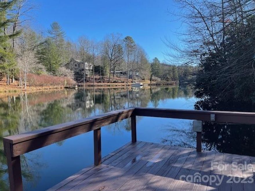 A little piece of Paradise on Lake Wanteska! Very peaceful location with beautiful gardens and lovely cabin retreat. This nicely upgraded home features an open floor plan, vaulted ceilings and wood flooring. All rooms are spacious and there are two bedrooms on the main level as well as two full baths. There are two stunning enclosed porches, one off of the Great Room and one attached to the Primary Suite. Downstairs you have an oversized 1 car garage for extra storage. There is also a finished space that can serve as a Bedroom/Office or Family Room. The large outdoor spaces feature gardens and a great fenced area for Pets. It is a short walk down to the Lake where you will find a new Dock with beautiful views of the lake. Bring your fishing pole because the Lake is stocked and the fishing is great. You might rather sit and enjoy a good book or a cooling swim on a summer day. Buyer to pay Amenity Fee of $10500 at time of Closing.