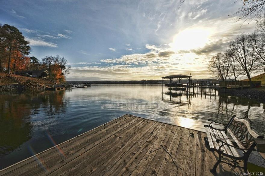 Location, Location! Beautiful custom waterfront home located in exclusive Anchorage neighborhood on the Tega Cay Peninsula. Large chef's kitchen, spacious main living areas, enjoy the water views from wall to wall windows in the two story great room, grand master suite with lake views, large secondary bedrooms, finished basement, media room, dock with lift, wooded lot. Tega Cay living at it's best! Fort Mill Schools.