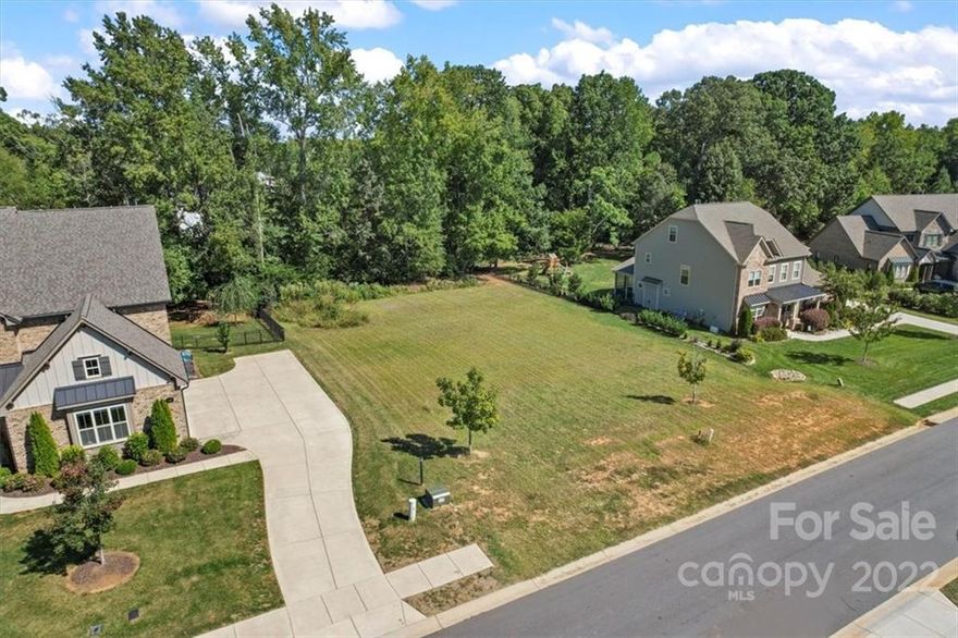 Bring your own builder and come build your dream home on the last available lot in the well established neighborhood of Rosecliff! The lot is already cleared and ready for you! Great location close to Charlotte, downtown Waxhaw, shopping, restaurants, great schools, and everything you could want. Rosecliff offers a walking trail, a community pond, and is conveniently located by Marvin Ridge Middle and High School. *No min square footage requirements, 12 month build time after arc approval, side load garages are required.*
