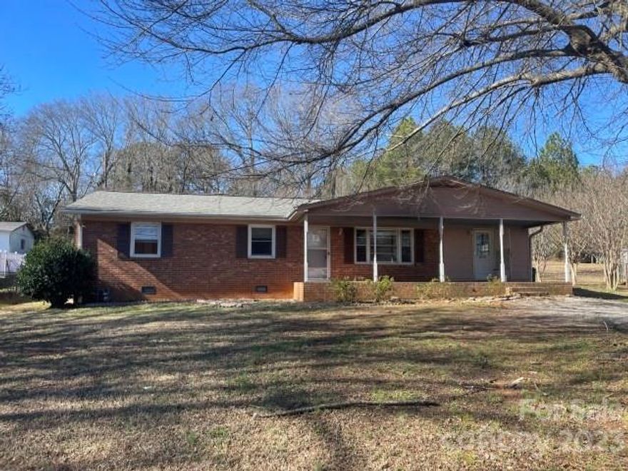 Brick Ranch with Covered Porch and Spacious Rear Yard. Home Features Hardwood Flooring, Living Rm, Den Kitchen with Dining Area.