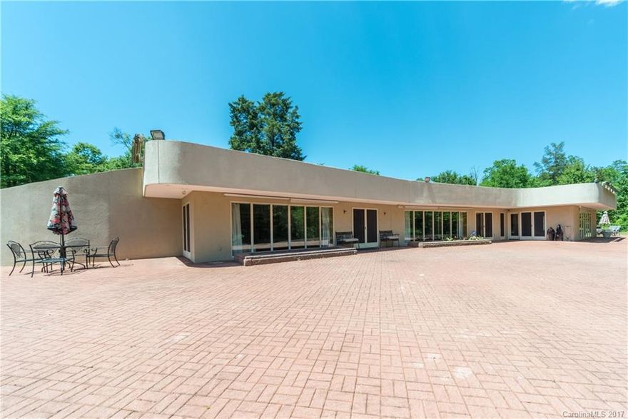 If You Are Looking For 9.45 Scenic Acres In The Heart of Lake Wylie This One Story Partially Underground Home May Truly Peek Your Interest.  You Will Love The Long Winding Drive Up To The Paver Terrace Which Runs The Length Of The Home.  The Entire Front Of The Home Is Filled With Windows. Great Open Floor Plan, Huge Great Room With Fireplace, Dining Area, Kitchen with L Shaped Bar, All Great For Entertaining!  Each Bedroom Has Its Own Fireplace and Full Bath,  The Master Includes A Bidet!