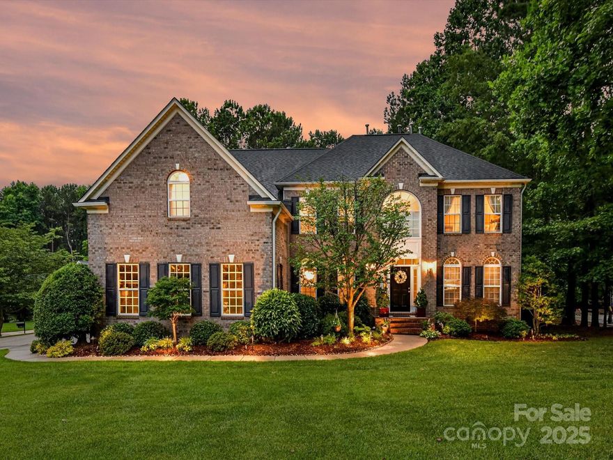 No detail spared in this exceptional 5-bedroom home nestled on a quiet cul-de-sac lot w stunning, fully finished basement. Kitchen features island w at-counter seating, double oven & gas cooktop. Breakfast area w vaulted ceiling & large windows looking out to gorgeous view of backyard. 2 story great room w stone fireplace & office w French doors on main. Primary bed w 2 walk-in closets & newly renovated primary bath w soaking tub & frameless shower. Bed 3 w en-suite bath. Showstopping basement includes a full bed w private entrance, full bath w frameless shower, custom wet bar, rec room & dedicated fitness room. Step outside to your private outdoor retreat: screened porch off basement, upper-level deck, paver patio & built-in firepit all overlook the beautifully landscaped yard. A wooded trail leads down to private kayak storage area - truly a one-of-a-kind setting. Ample walk-in storage in basement. See attachments for full list of upgrades & features.