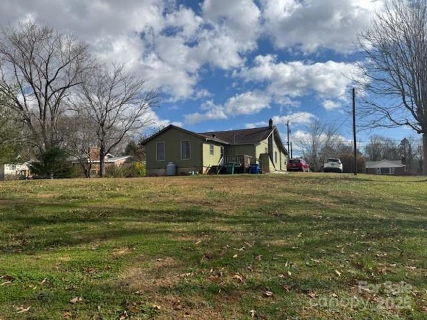 Attention investors and developers! Rare, large, cleared and mostly level lot with access to city water/sewer. With over 120 ft of road frontage and 1.54 highly usable acres, this parcel is ideally suited for 4-6 homesites of generous size. Potential configuration could be a cul-de-sac or flag lots. Buyers and agents to verify the feasibility of building, usage and development. Established neighborhood has sidewalks and mature trees. Within walking distance of downtown Weaverville and only a 10 min drive to downtown Asheville. 1920's 5 bed 2 bath home in need of major renovations or removal. Home has no value. Seller states the roof is approx 10 years old and has an in-use underground oil tank. Two driveways are currently in place. Sewer easement along the back border of the property. Another sewerline mid-property could be rerouted if necessary. Newer storage shed on the property can be conveyed or removed. Some mountain views. Very peaceful, quiet location. Must see to appreciate. Cross-listed as 1.54 acre lot. PLEASE SCHEDULE ALL SHOWINGS INCLUDING LOT ONLY VISITS THROUGH SHOWINGTIME, SELLER LIVES IN HOME.