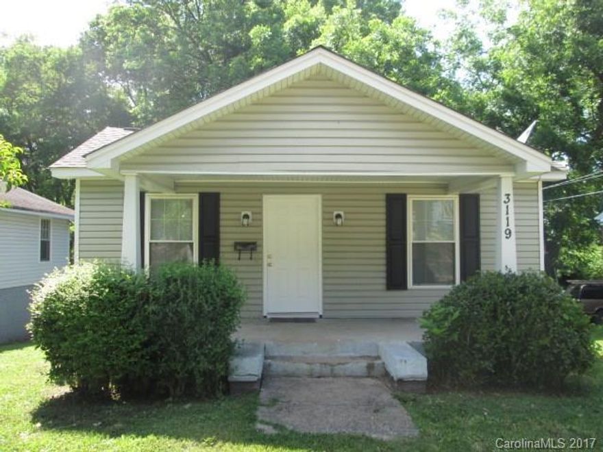 Hardwoods and ceramic tile throughout. Decorative fireplace, two bedrooms with extra room that could be used as a third bedroom. Fresh paint!