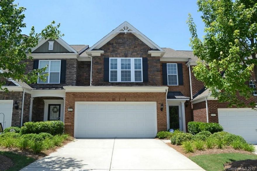 Full brick townhome located in South Ballantyne off Ardrey Kell Road. Features include an open floor plan downstairs, gas fireplace, granite counter tops, cherry cabinets, hardwoods in foyer, kitchen and half bath. 3 bedrooms and 2 bathrooms upstairs. A spacious Master Bedroom, Bath with separate shower and tub and massive Walk-in Closet. Neighborhood offers a community pool and is conveniently located within walking distance of local shops and restaurants.