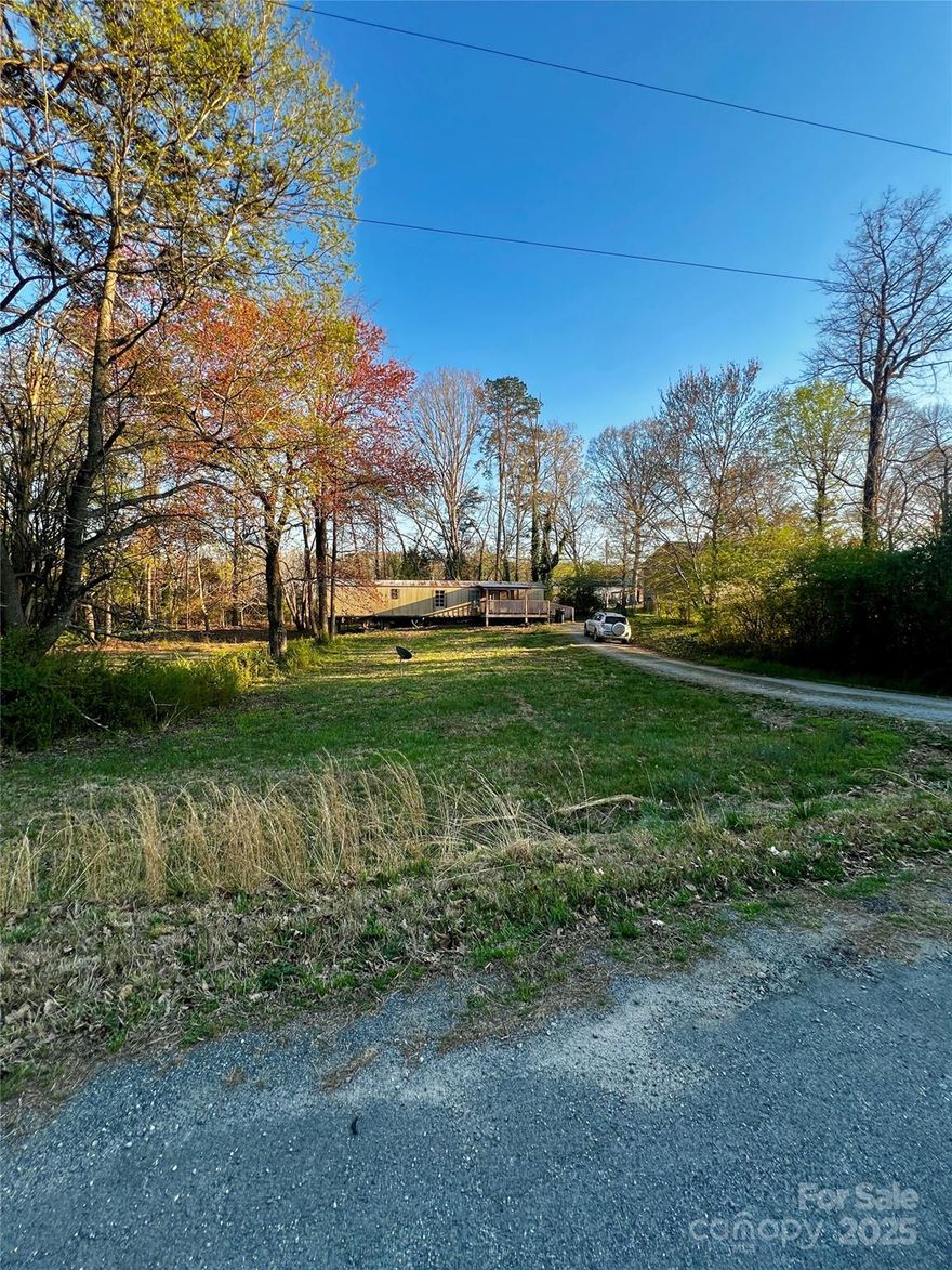 This lot must be sold together with the neighboring 0.52-acre parcel, offering you almost a full acre to build the home you've always dreamed of. Enjoy the freedom of no building restrictions, no HOA, and low county taxes—a rare find! Conveniently located just minutes from Interstate 77, with easy access to Mooresville’s top dining, shopping, and amenities.