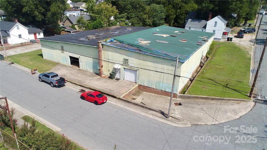 Free standing 10,600 SF warehouse that currently being used as warehouse and dry storage. The property features a loading dock and a drive in door.  The property is demised into two units with a brick wall between each units. The right side has a concrete slab, while the left has wood flooring with crawl space. Please see property disclosures below for the list of material facts the property before inquiring. 

Substantial Deferred Maintenance:
The property is being sold “as is” and currently has roof leaks, structural deficiencies, and many other necessary improvements. 
Occupancy:
The owner occupies approximately half of the building. The remaining unit is leased on a month-to-month, verbal agreement.
Conveyance of Personal Property:
The owner will remove select materials from the premises prior to closing. Any remaining items will convey with the sale.
Zoning: 
The property is currently zoned RC; however, it operates as a legal non-conforming use for warehouse/storage purposes, provided it does not remain vacant for more than 180 consecutive days. A zoning confirmation letter verifying this status is available upon request. For further questions please call the Concord planning department 704-920-5152
** Listing Price contemplates all property disclosures and property condition.