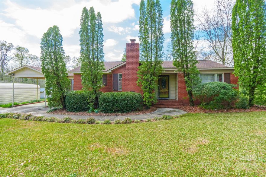 Step into this delightful 3 bedroom, 2 bath brick ranch, nestled on approximately 1.5 acres of land. Upon entry, you'll be welcomed by the inviting ambiance of the living room, featuring a timeless brick fireplace ideal for intimate gatherings. The kitchen is bathed in natural light from its numerous windows, creating an airy and welcoming space. It seamlessly transitions into the spacious dining area, complete with built-in cabinets and shelving for added convenience. With three generously sized bedrooms and ample storage throughout, this home effortlessly combines comfort and functionality. Outside, discover additional amenities such as a pole barn and an outbuilding equipped with electricity and water, offering endless possibilities for hobbies or storage. With its perfect blend of comfort, convenience, and country charm, this property presents an idyllic place to call home.