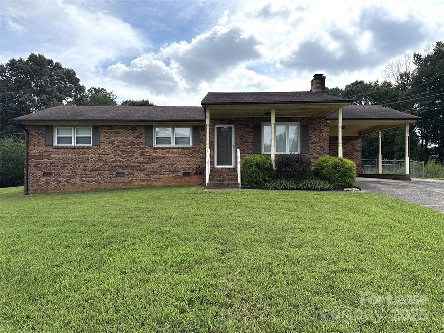Welcome to the T.R. Lawing Realty Property, a charming 3-bedroom, 1.5-bathroom home located in the vibrant community of Gastonia, NC. This property boasts a spacious carport, perfect for protecting your vehicle from the elements. The fenced backyard provides a secure and private outdoor space for relaxation or entertaining. Additionally, the outside storage shed offers ample space for your storage needs. With its blend of comfort and convenience, this home is a perfect place to create lasting memories. Fireplace is for decoration only. 18-month lease available. Please note Renters Insurance is required. Pet charge is per pet that does not exceed 35 lbs.