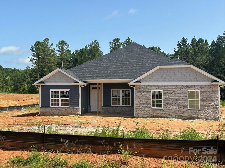 Only $1000 down to write contract! This new constructed home is situated in the beautiful Lauren Pines subdivision in York on a 1 acre lot. This 2100 sf ranch with 4 beds & 2 baths  is spacious & open with an incredible layout, great for entertaining. The spacious kitchen & island overlook the very large family room with vaulted ceilings and gas fireplace. 4th bedroom/study with double door entrance lets in lots of natural light. Included in this home are quartz countertops, tiled kitchen backsplash, stainless steel appliances, gas range, laminate wood flooring throughout the main areas, side load garage  and primary bathroom with 5' tile shower. Enjoy the tree-lined view from the 16 x 14 covered deck. Projected completion date September 2024. 5K towards rate buy- down  and closing costs paid with use of preferred lender. All home features are subject to change without notice.