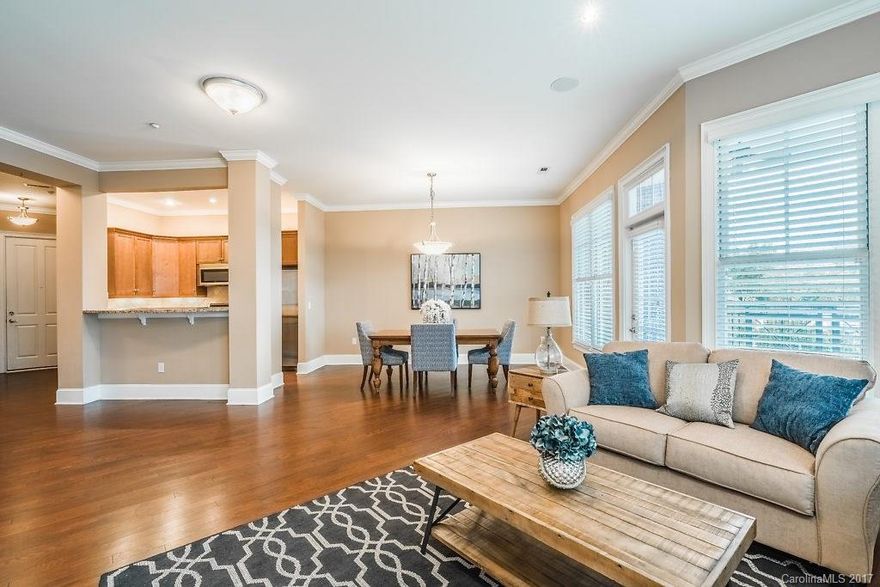 Fabulous one level living in this luxury home that is minutes to Uptown, Southpark, & convenient to the airport! Spacious interior features 10' ceilings, 8' doors, oversized windows, Bosch SS appliances (refrig & W/D remain too!), granite & tumbled tile backsplash. Dual master suites & large laundry rm w/ great storage & workspace! Almost 200 sq.ft. covered terrace w/ ceiling fans and fireplace w/ built ins are nice extras. Secure bldg. access & gated secure parking garage.