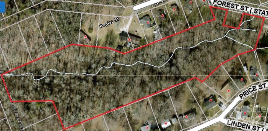 7+/- Mostly Wooded Acres located in the town of Clover. This lot could be a recreation tract or possible house site.  There are some mature trees and a creek that runs through the property. Access to the property is on Forest Street. Please look for the real estate sign!