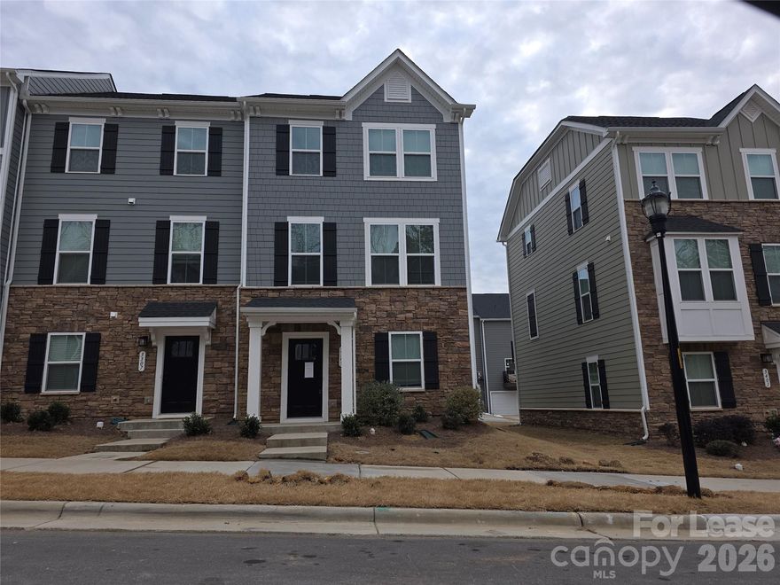 End unit 3 level townhome located in Stallings with convenient access to Interstate 485 and Highway 74. Open floorplan with 3 bedrooms and Main level features 2 car garage with Tesla Charger inside garage, Den/Recreation room with multiple closets, Second level has a wide open floor plan with kitchen, dining, and living area. Upper level features large primary bedroom and bath, Two additional bedroomighs and a hallway full bath.