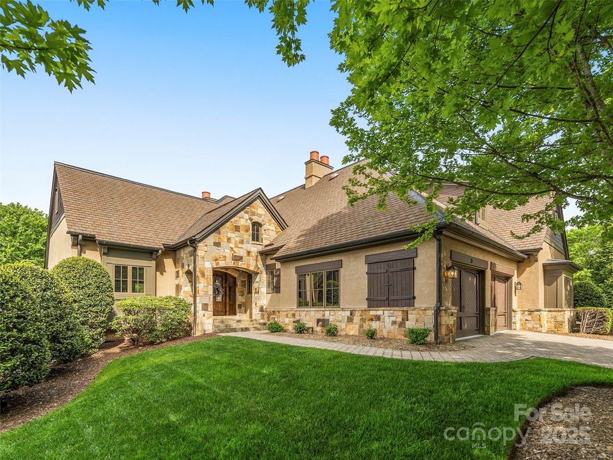 This beautifully updated stone townhome blends rustic charm with modern elegance and smart home features. Located just one minute from the gates and close to the Clubhouse and the Jack Nicklaus Signature Golf Course and tavern grill, it offers serene views of green space, water features, and mountains. The main level features open living, a gourmet kitchen with Wolf and Subzero appliances, and a spacious primary suite with vaulted ceilings and a recently renovated spa-style bath retreat! Enjoy year-round outdoor living with a covered porch, terrace, and remote-controlled screens. Downstairs offers two guest suites, a steam shower, and a private patio. Meticulously maintained with custom finishes throughout. New HVAC is being installed. This is mountain living at its finest and is being offered turn-key and fully furnished with the exception of a few personal items. See agent for the list of exceptions. Membership available.