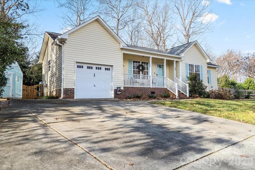 Impeccably maintained & beautifully styled home; with tons of updates! Stainless steel smart kitchen appliances, with quartz countertops & polished tile backsplash. New LVP flooring throughout, with ceramic tile in bathrooms. New bathroom vanities, dual flush toilets, & modern lighting throughout. Brand new screened in back porch with ceiling fan, perfect to enjoy your tree-line oasis & private back yard. Spacious fenced in yard boasts lush landscaping & stunning florals in season! Home is equipped with a 1-car garage & an additional storage building!  Centrally located with many attractions near by; only 2 miles to Lake Norman State Park, 2 miles to downtown Troutman, or 1.5 miles to Safe Harbor Marina & Lake Norman! No HOA. Don't miss this GEM!