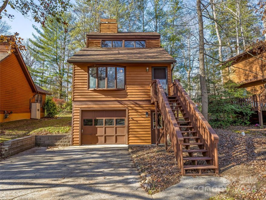 Priced below tax value, check out this convenient property near Airport Road & I-26, but in a charming & quiet neighborhood! Ready for your signature touch & updates, this lock-&-leave home is perfect for savvy investors or perspective homeowners. The open living area with vaulted ceilings, cozy wood touches throughout, stone gas log fireplace and roomy deck for outdoor relaxing all add up to a special property for the buyer with vision. Lawn maintenance is included in HOA fee and STR's are permitted and abundant in this convenient, cute community. A newer roof creates peace of mind for a new homeowner. While the corner of the lot sits inside of 100 yr flood fringe area, the home is outside of this area - flood determination letter provided shows no flood insurance is required for lenders. Whether you're looking for a personal retreat or potential income-generating asset, this well-designed property presents an incredible opportunity for discerning buyers seeking both comfort & value.