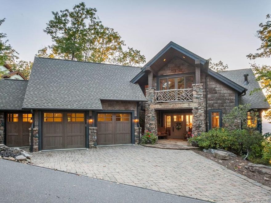 This beautiful custom home in Mountain Air combines rustic charm with sophisticated design to create the ultimate mountain retreat. Walls of windows flood the open living spaces with warm light, long-range views. Main level living features fantastic chef's kitchen, great room with stone FP, spacious MBR suite. Lower level has large den with FP, bedrooms and bonus spaces incl. workshop/studio. Plus a loft and multipurpose room over garage. Dual-fuel HVAC and whole-house generator.